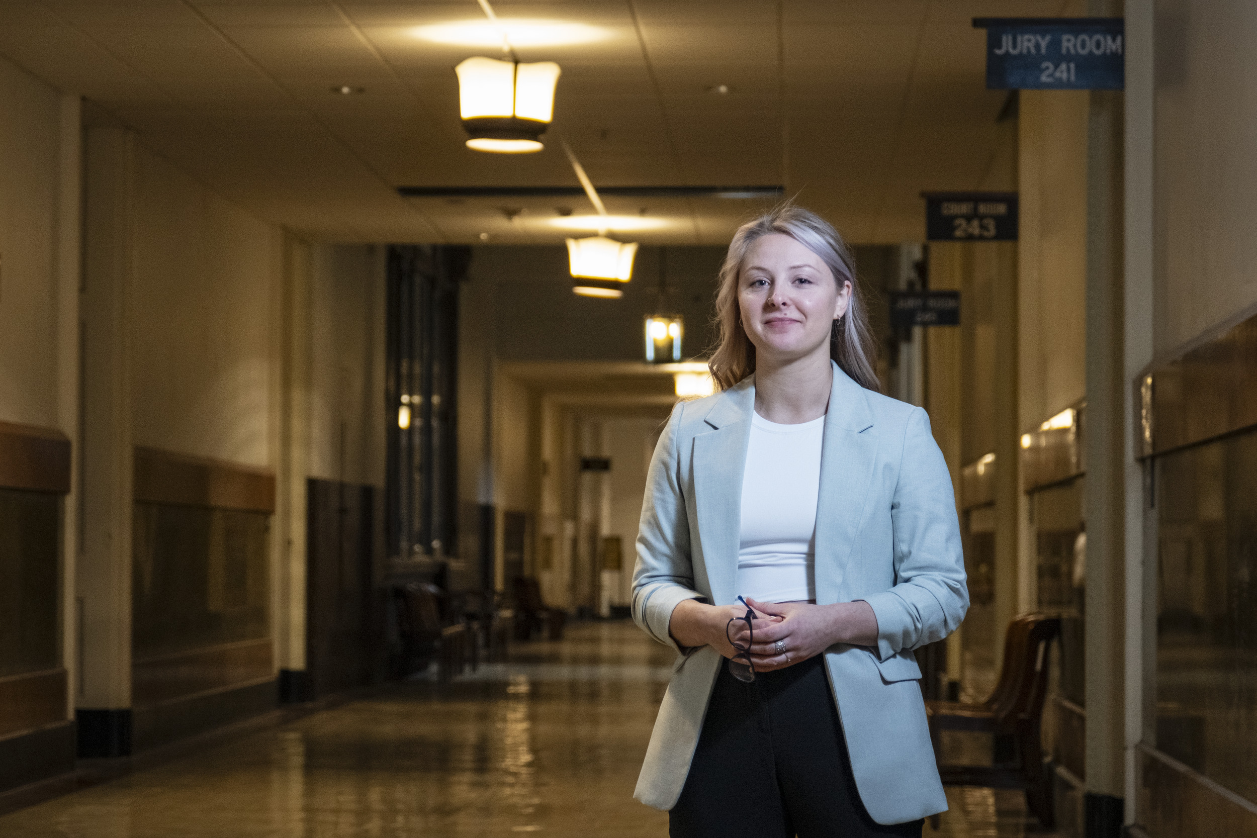 Anna Breece poses for a photo inside city hall.