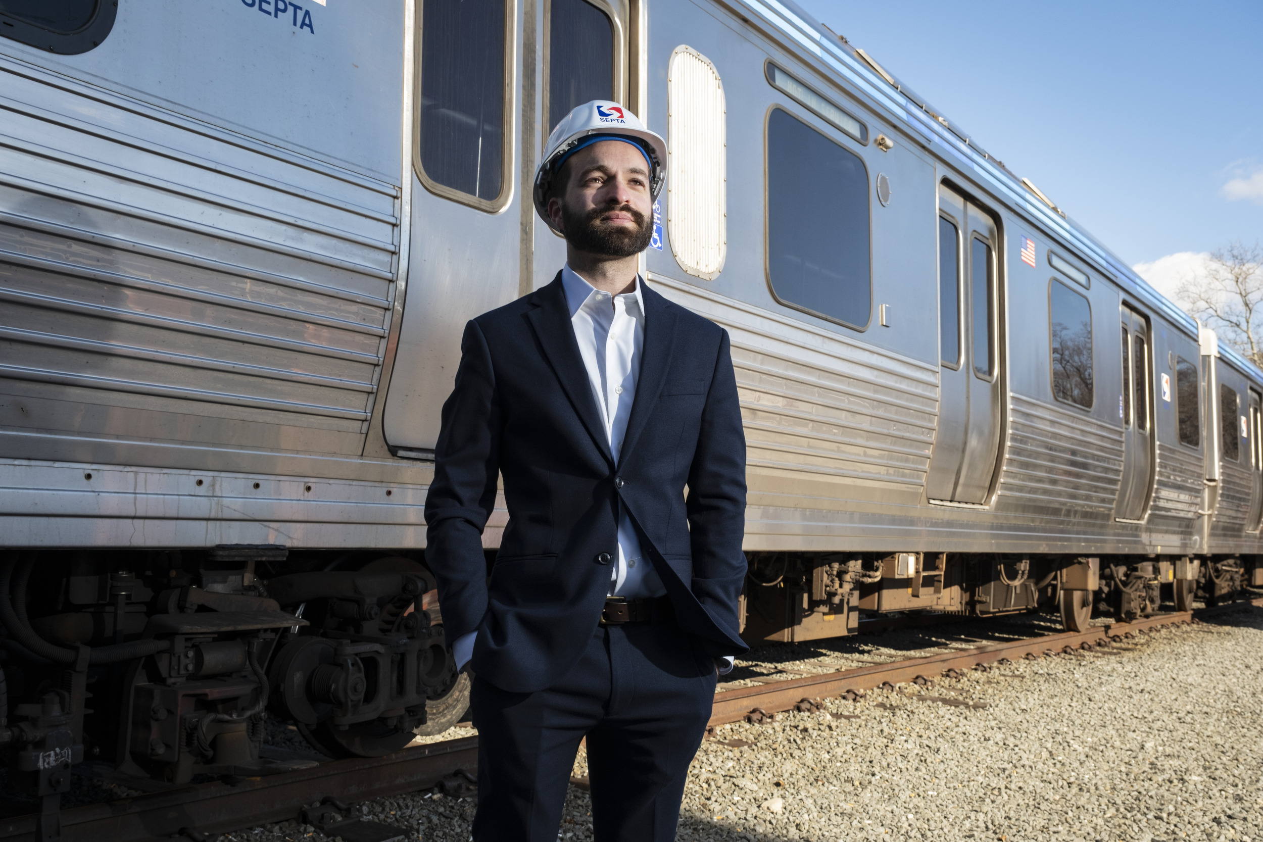 Benjamin Aitoumeziane poses by a SEPTA train.