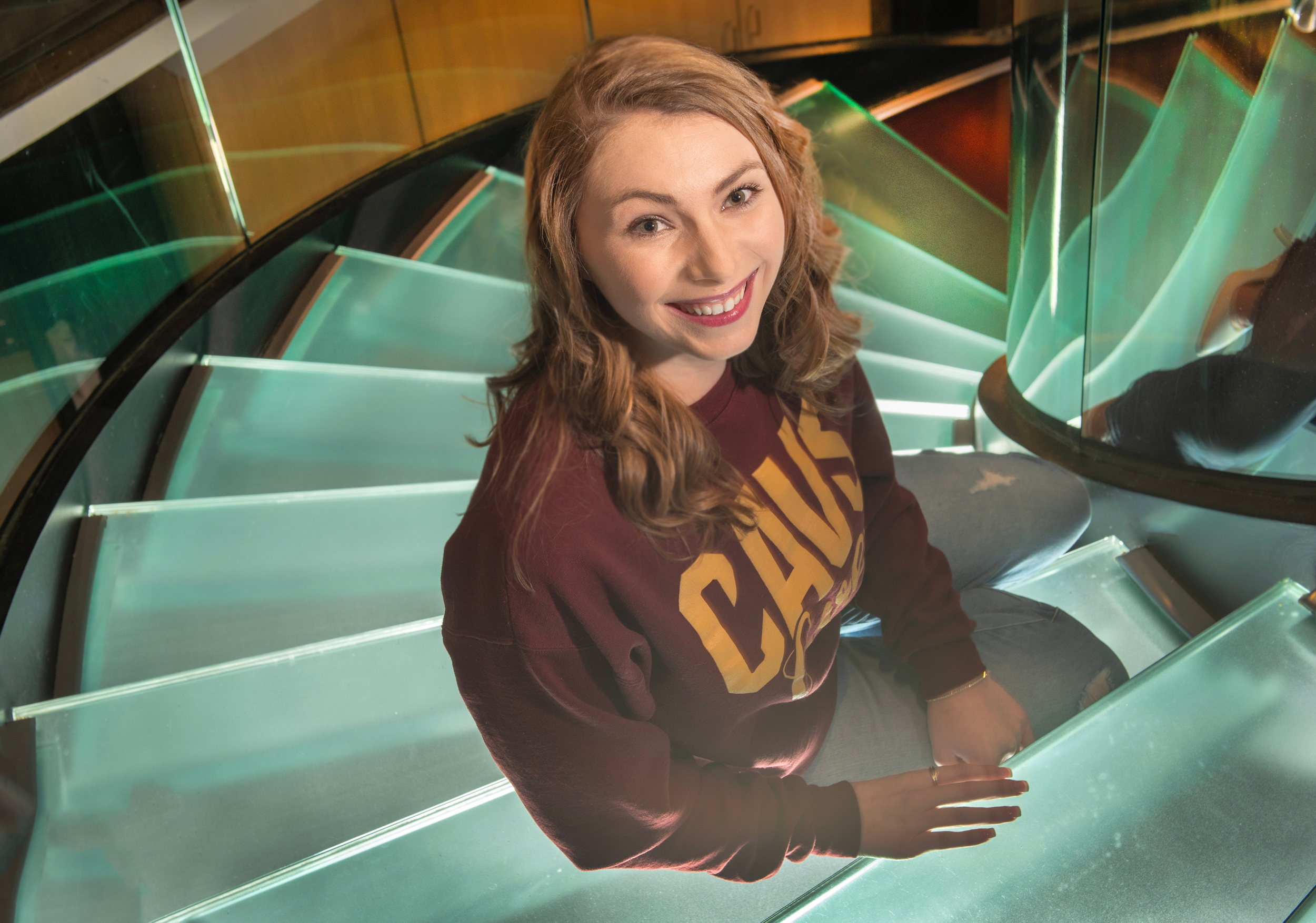 Mary Kate Meal sitting on stairwell
