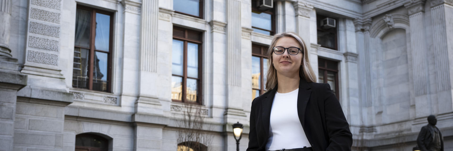 Anna Breece standing in front of City Hall.