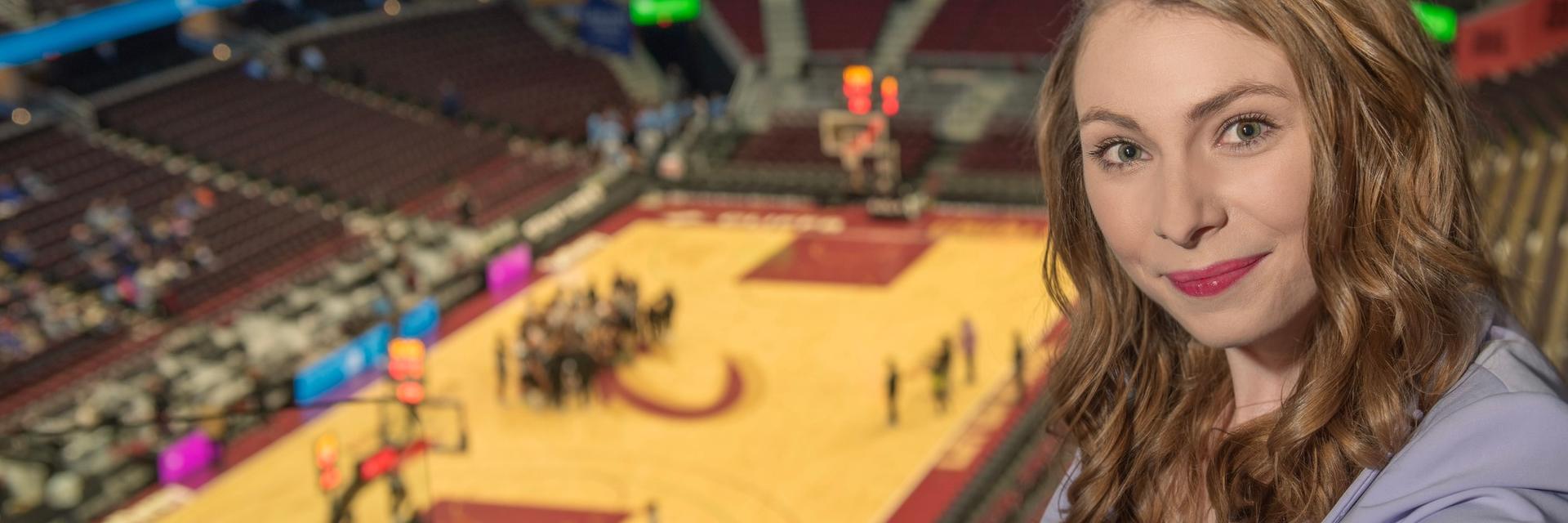 Mary Kate Meals poses for a photo in the Cleveland Cavaliers arena.