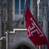 The Temple T flag waving on campus