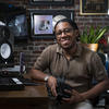 Benjamin Thomas poses for a photo with his mixing equipment.