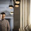 Evan Wise walks down a corridor. 