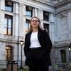 Anna Breece poses for a photo outside of city hall.