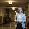 Anna Breece poses for a photo inside city hall.