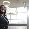 Simone Snead standing in front of neighborhood buildings in the city