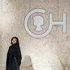 Deja Houser poses for a photo in front of the CHOP building.