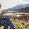 Alexandra Leber sitting by a pond.