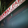 An image of the sign outside of the baseball stadium that reads Fenway Park