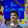 Nick Santangelo smiling in front of the FunScienceToons title screen.