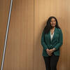 2026 30 Under 30 honoree Brittany Lue wearing a green suit and leaning against a wall