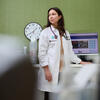 30 Under 30 honoree Ivana Kohut standing at a computer in a hospital room and looking over her shoulder