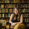 30 Under 30 honoree Michelle Ferguson Shore smiling and sitting in front of a bookcase 
