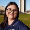 Leah Wenhold Parente smiles into the camera.