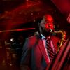 30 Under 30 honoree Christian Lewis playing his saxophone