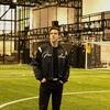 Owen Pearl poses for a photo inside of a Nike sports facility.