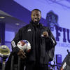 Najeeb Emmanuel poses with a ball.