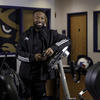 Najeeb Emmanuel poses with athletic equipment.