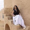 Yostina Yacoub sitting on steps for a photo.