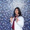 Riya Kulkarni smiles while holding her stethoscope.