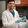 Soham Apte poses with dental equipment. 